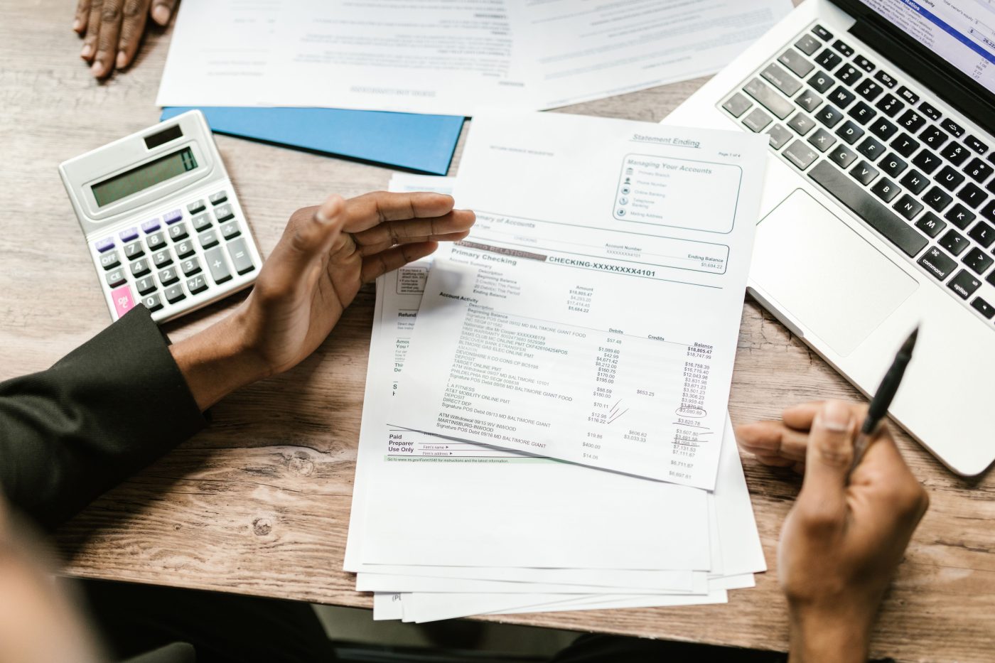 Invoices and financial paperwork laid out on a desk